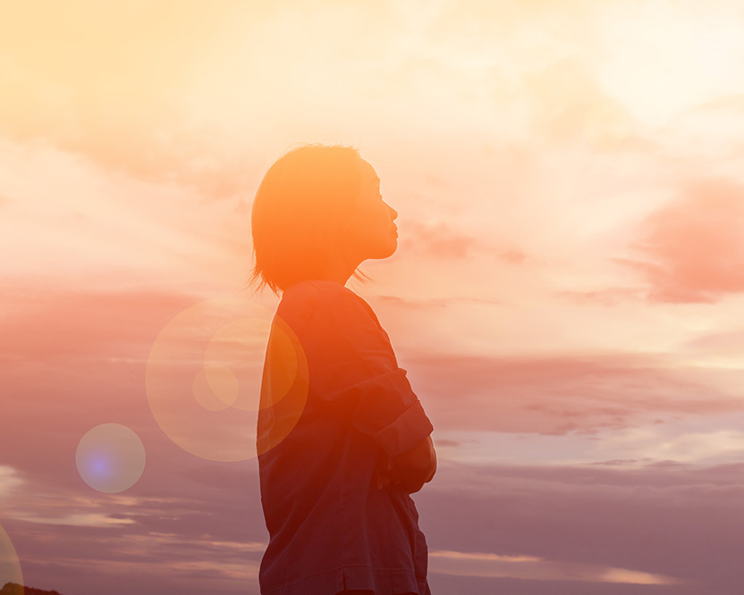 faith_inclusive_counseling_plano Woman turning toward the clouds; faith-inclusive counseling