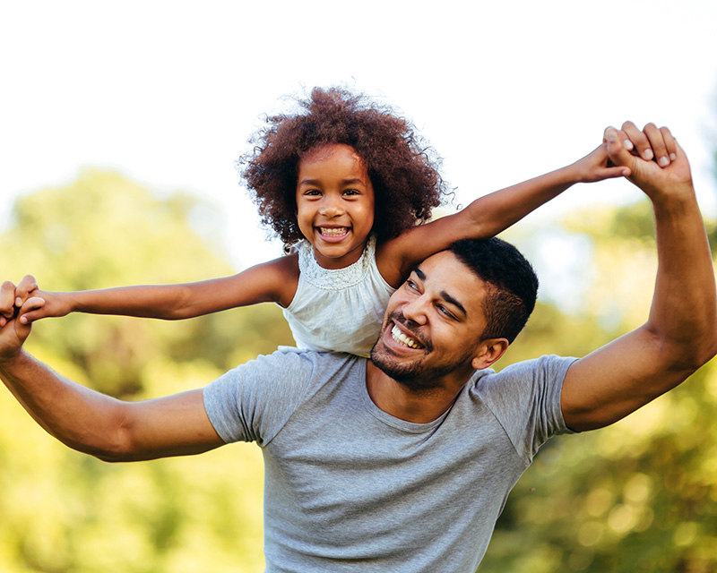 parenting_counseling_support_plano_texas Father and daughter playing outside