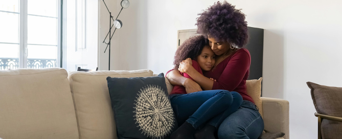 Mother hugging child; Connection before correction