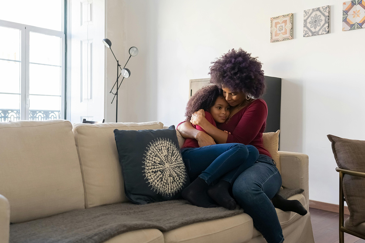 Mother hugging child; Connection before correction